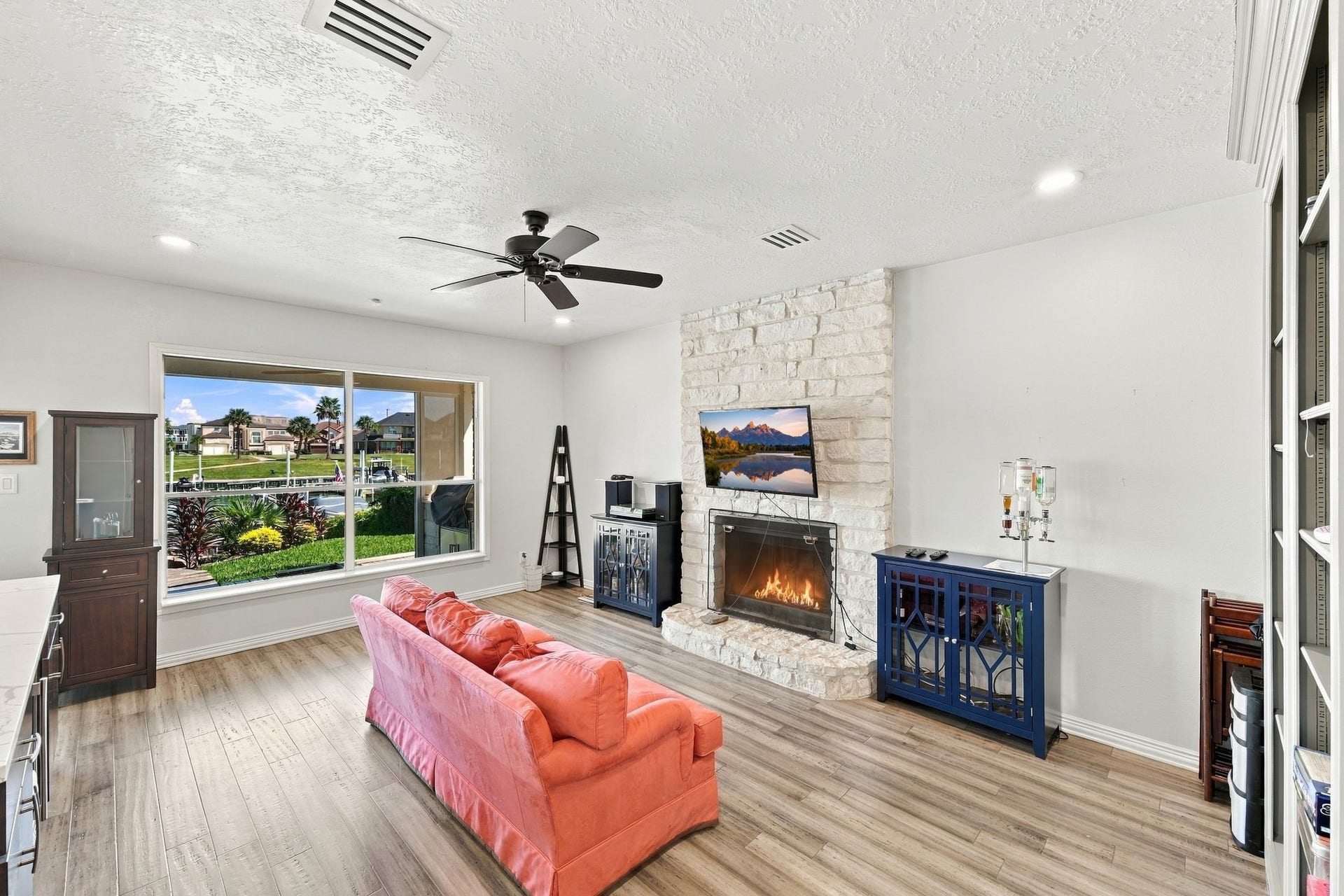 932 Plantation Street, League City, TX 77573 The den features a second wood-burning fireplace and a large picture window.