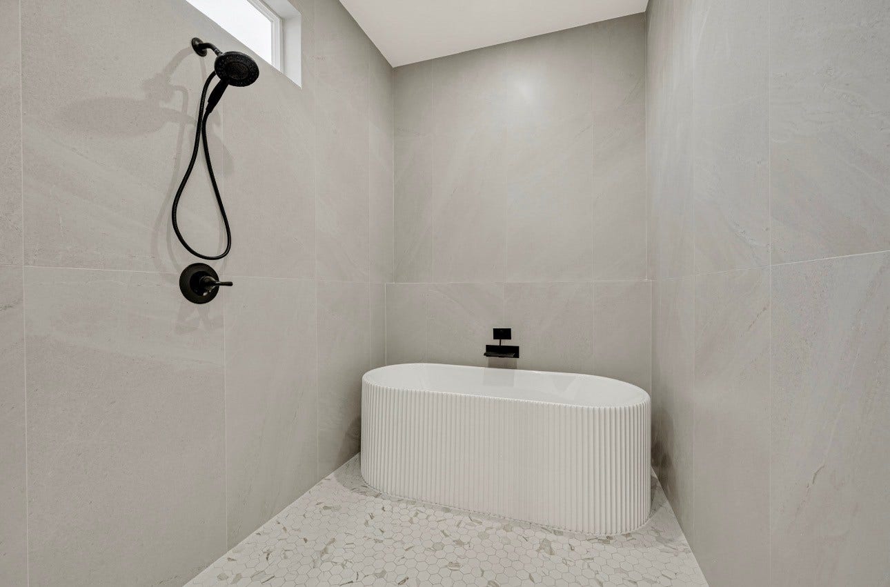 Large primary bathroom with tub/shower.