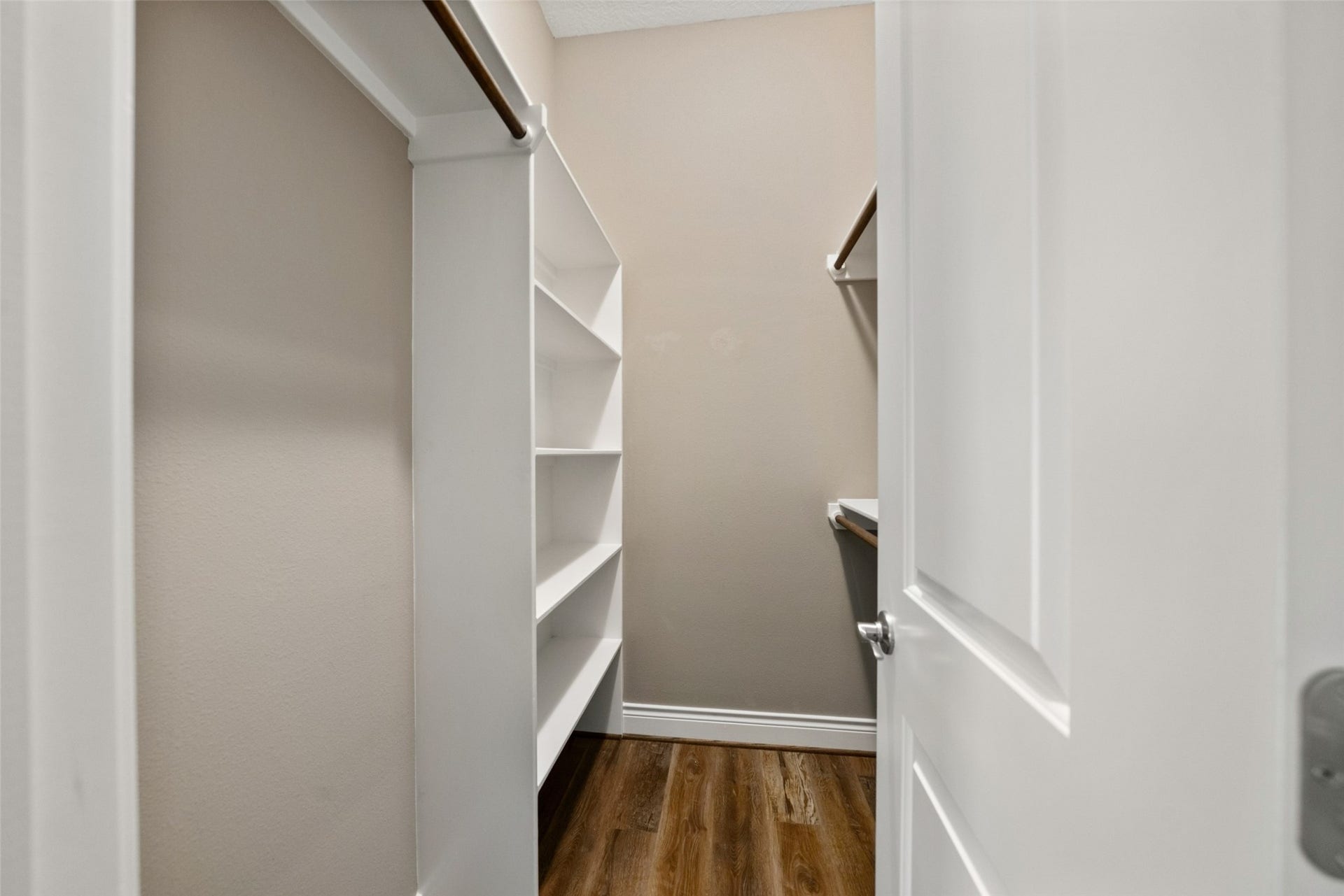 1125 Galveston Street, Hempstead, TX 77445 Walk-in storage area with built-in shelving and hanging space.