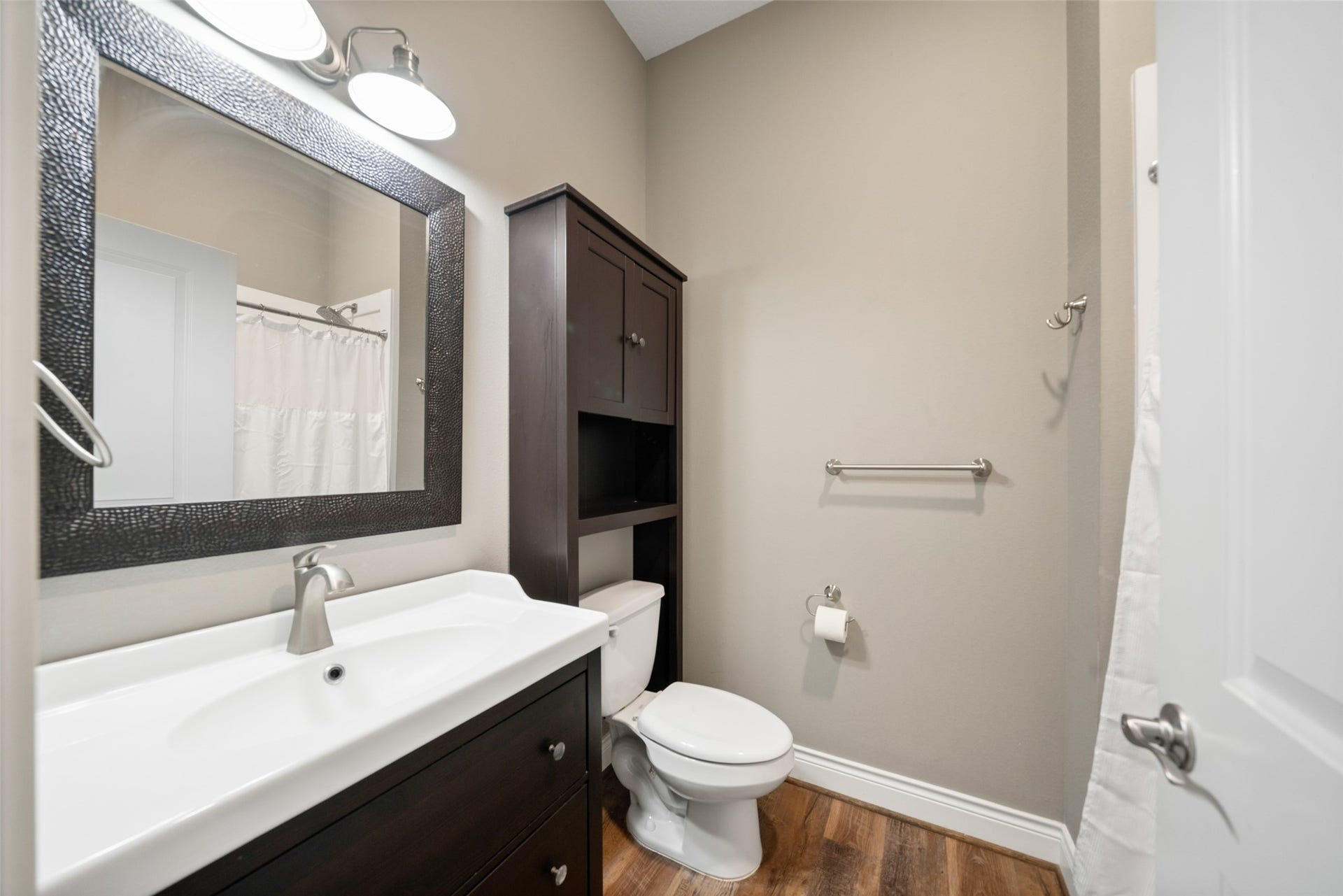 1125 Galveston Street, Hempstead, TX 77445 Bathroom featuring a wide vanity, framed mirror, overhead lighting, and a tub/shower combination.