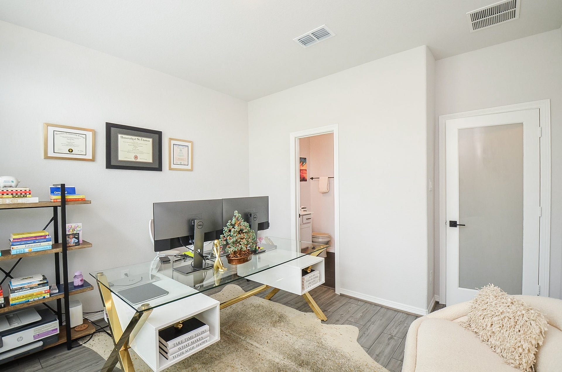 30706 Hawthorn Glen Court, Fulshear, TX 77441 Bright home office featuring a cozy seating area, perfect for productivity and comfort.
