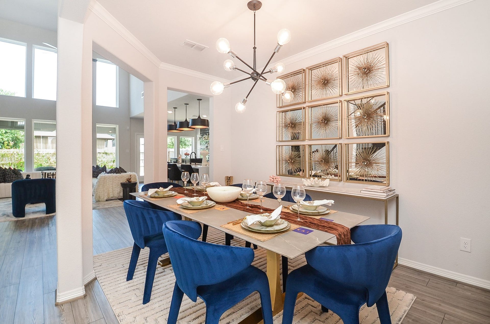 30706 Hawthorn Glen Court, Fulshear, TX 77441 Elegant dining area that seamlessly flows into a spacious living room with abundant natural light.