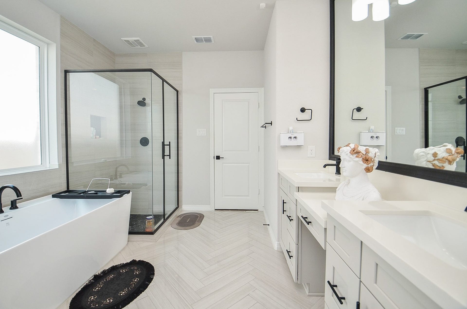 30706 Hawthorn Glen Court, Fulshear, TX 77441 Elegant bathroom featuring a spacious glass-enclosed shower, modern freestanding tub, and dual vanities with sleek fixtures.