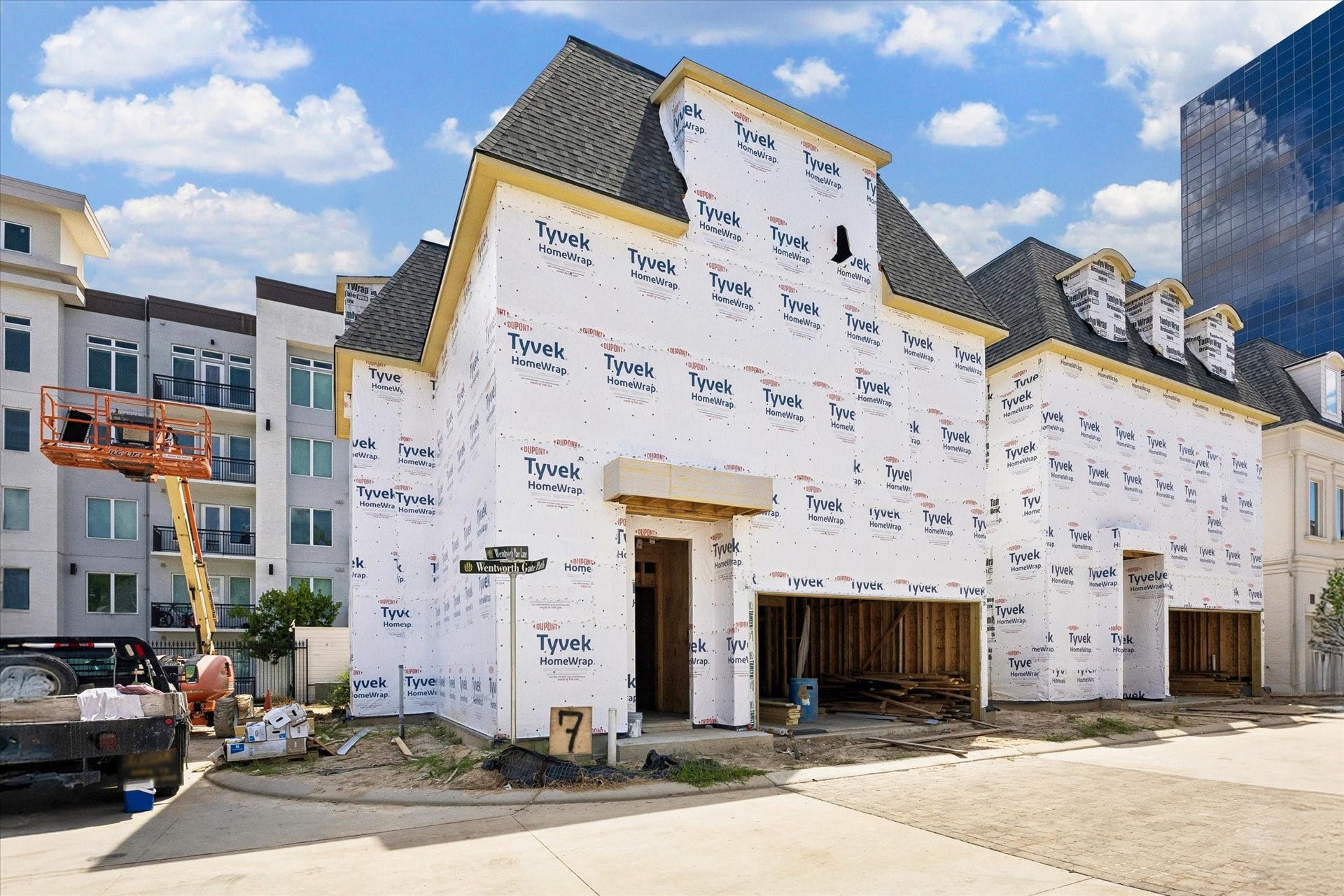 7 Wentworth Gate Path, Houston, TX 77027 Upon completion, this home to feature a solid African Mahogany front door with a glossy lacquered finish, premium Emtek door hardware, and copper gas lanterns.