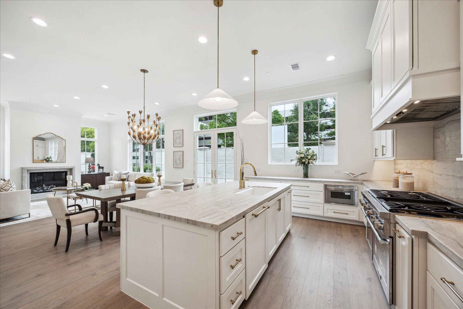 7 Wentworth Gate Path, Houston, TX 77027 Oversized island and undermount Porcelain sink with Kallista faucet will complete this luxury kitchen. Ample prep space, storage space, and island seating make this space functional and stunning. **Photo is of another home in the community and for information purposes only. Buyer to verify all details.**