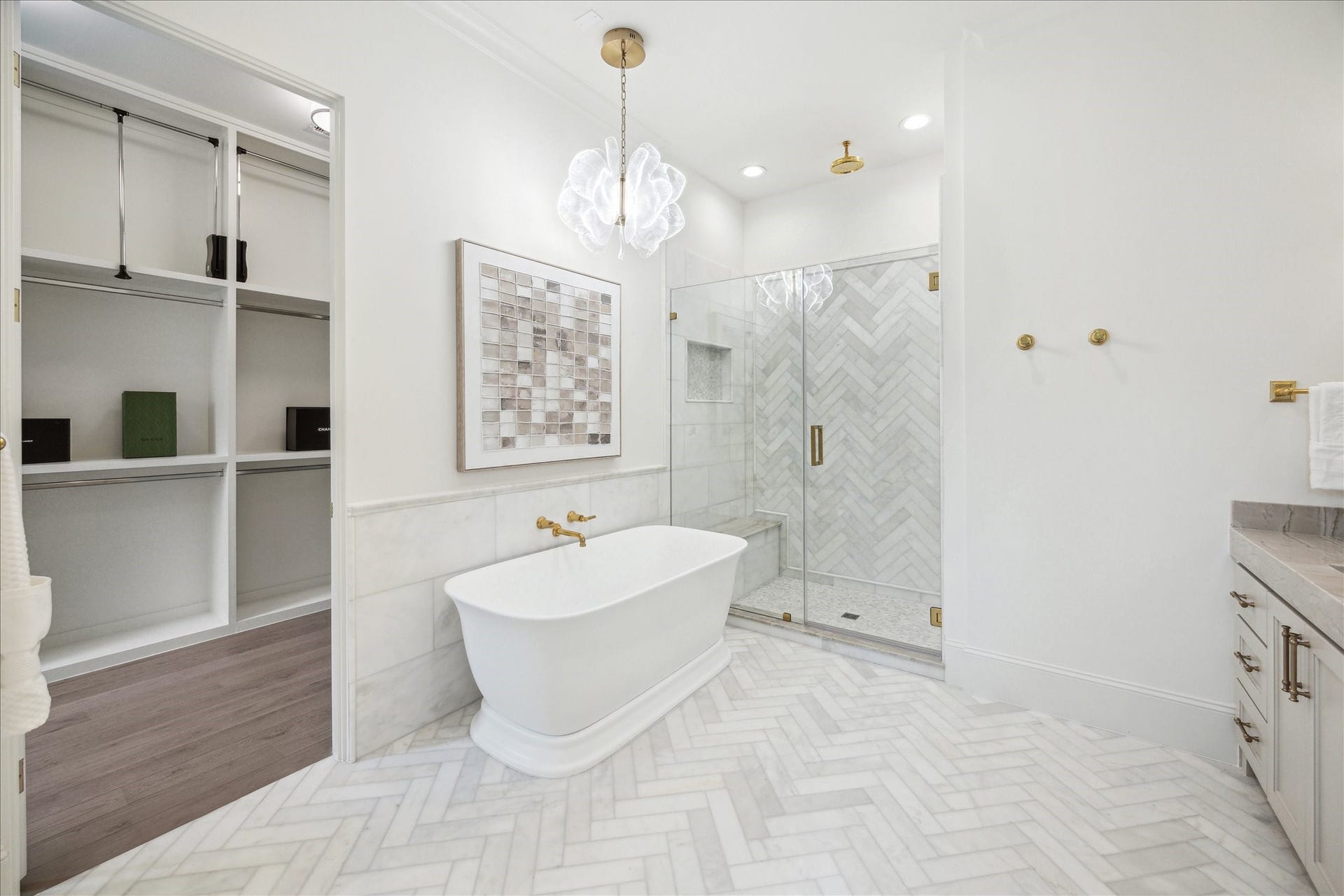 7 Wentworth Gate Path, Houston, TX 77027 Primary bathroom to feature a soaking tub with Kallista wall-mounted faucet and framed glass shower with Laticrete shower system. **Photo is of another home in the community and for information purposes only. Buyer to verify all details.**