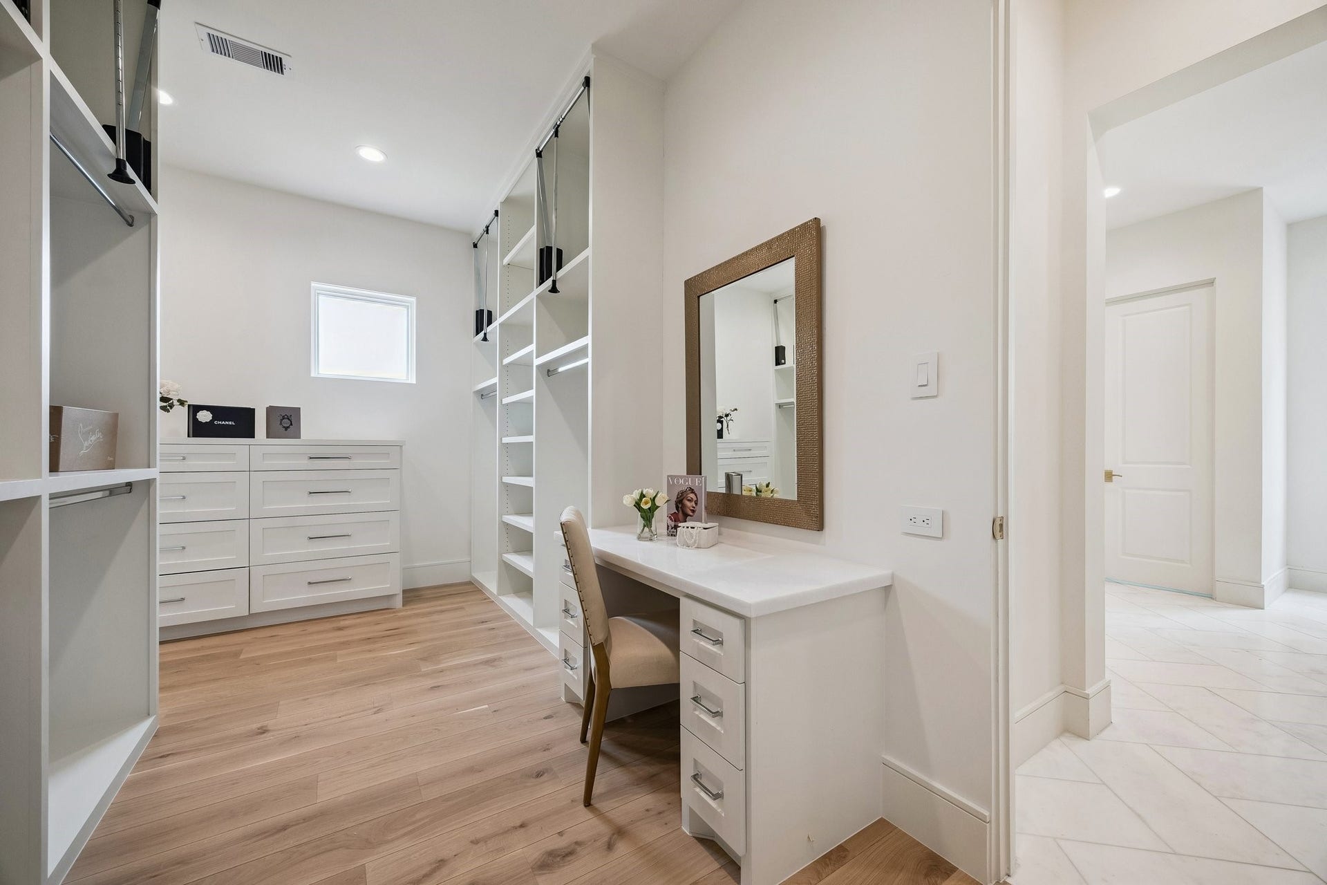 7 Wentworth Gate Path, Houston, TX 77027 Built-in vanity in the second primary closet. **Photo is of another home in the community and for information purposes only. Buyer to verify all details.**