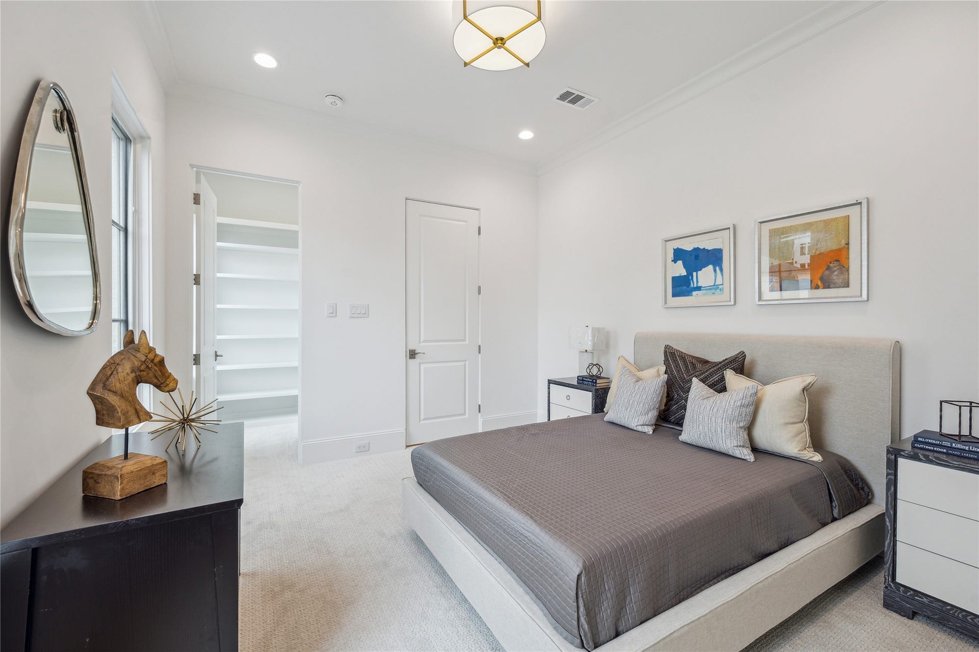 7 Wentworth Gate Path, Houston, TX 77027 Second-floor bedroom to feature a spacious walk-in closet and high-performance carpet. **Photo is of another home in the community and for information purposes only. Buyer to verify all details.**