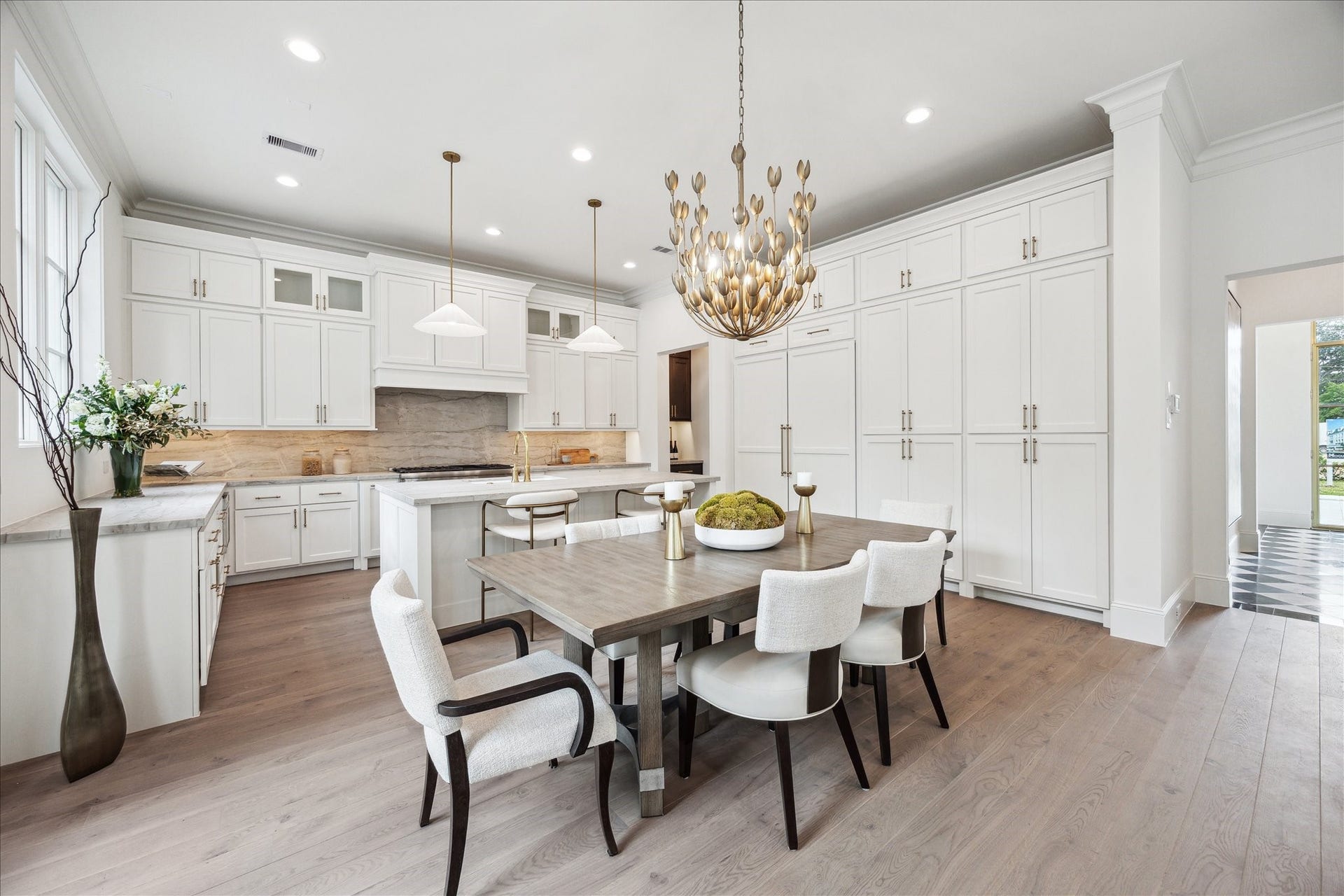 7 Wentworth Gate Path, Houston, TX 77027 Dining space is located directly off of the living. Ample windows and a set of french doors fill this space with light. **Photo is of another home in the community and for information purposes only. Buyer to verify all details.**