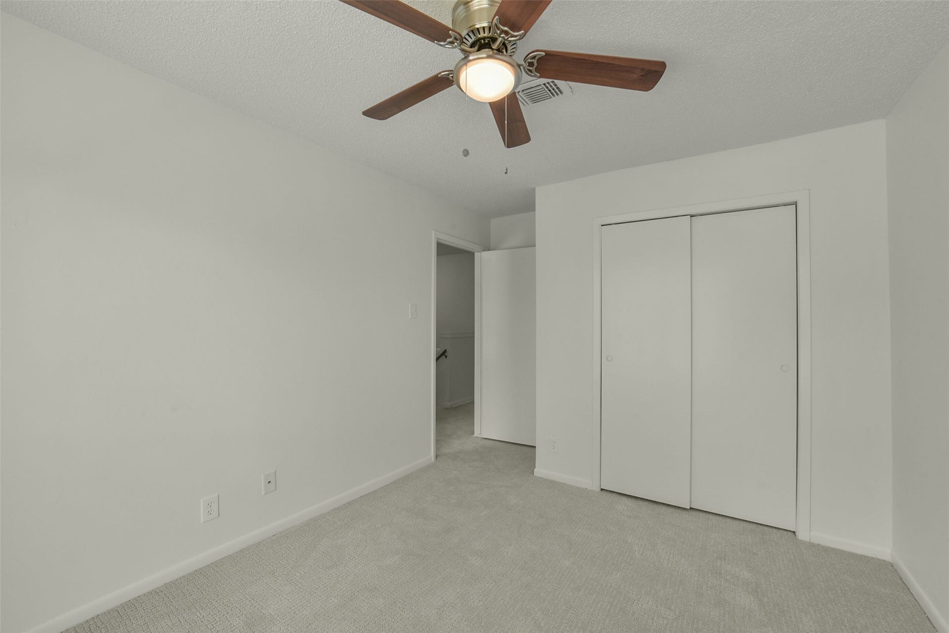 View of bedroom number 2 with NEW carpet.