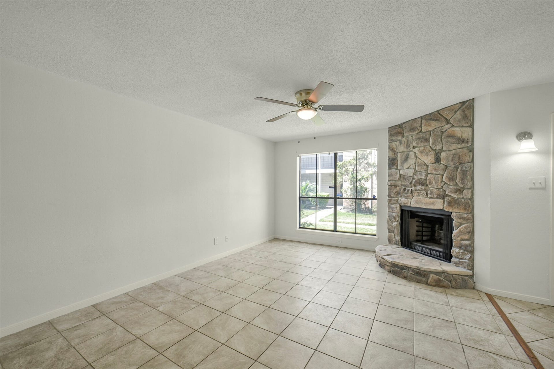 The living room is bright and open. Notice fresh paint throughout.