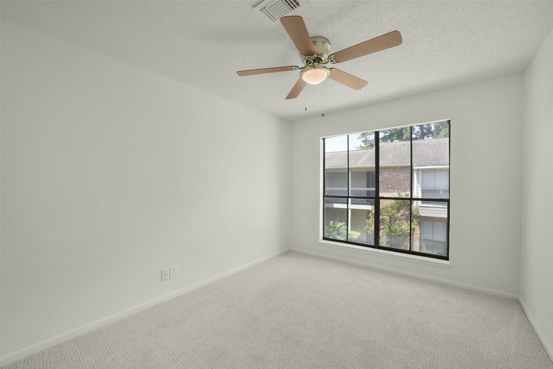 View of bedroom number 2 with NEW carpet.