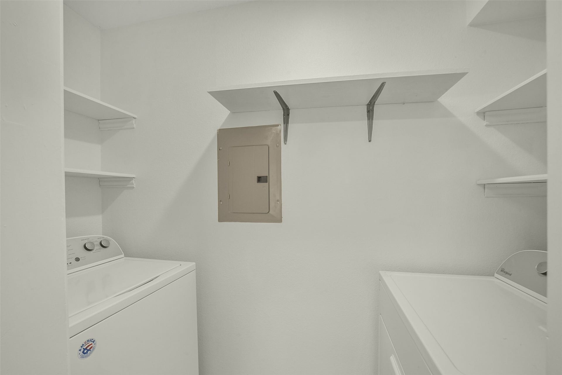 Laundry room is located in the unit.