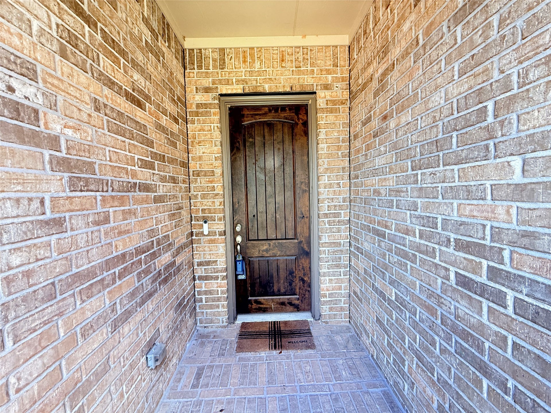 20635 Riley Copper Drive, Cypress, TX 77433 Covered front entry with beautiful brick pavers and a solid wood door. Did you notice the stone elevation above the arch?