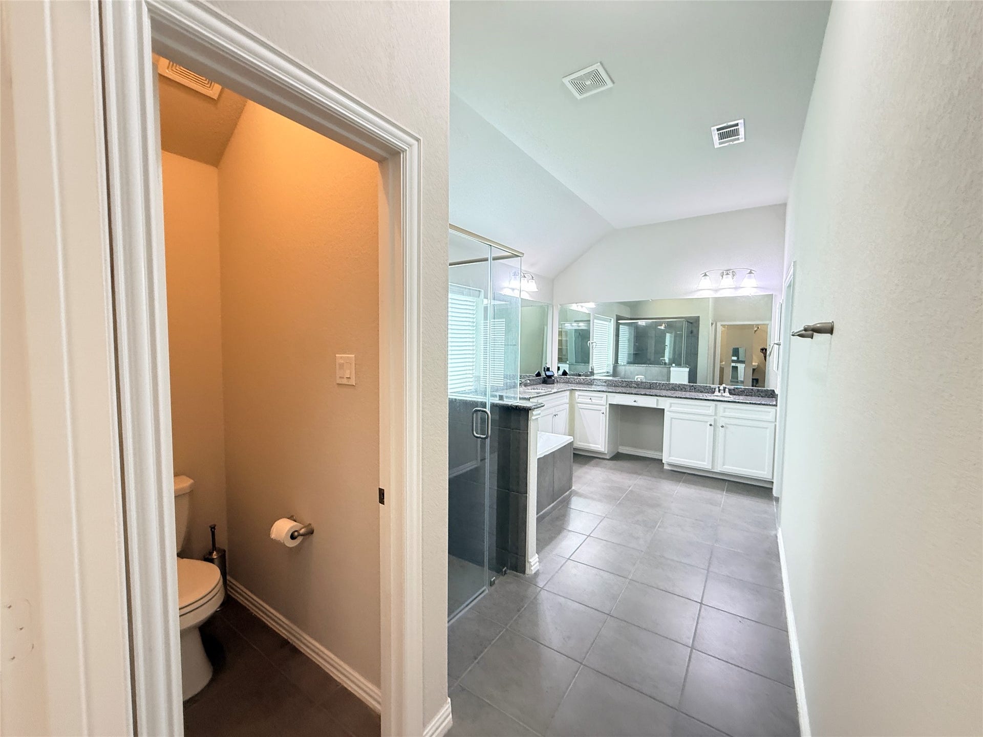20635 Riley Copper Drive, Cypress, TX 77433 The view from the primary closet of the entire primary bath. It's pretty expansive!