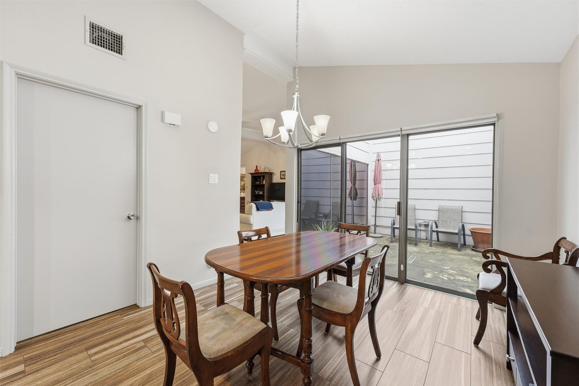 Dining area could be an additional sitting area/TV room, office or hobby space.  It features high ceilings & opens to the atrium, primary bedroom, & family room!