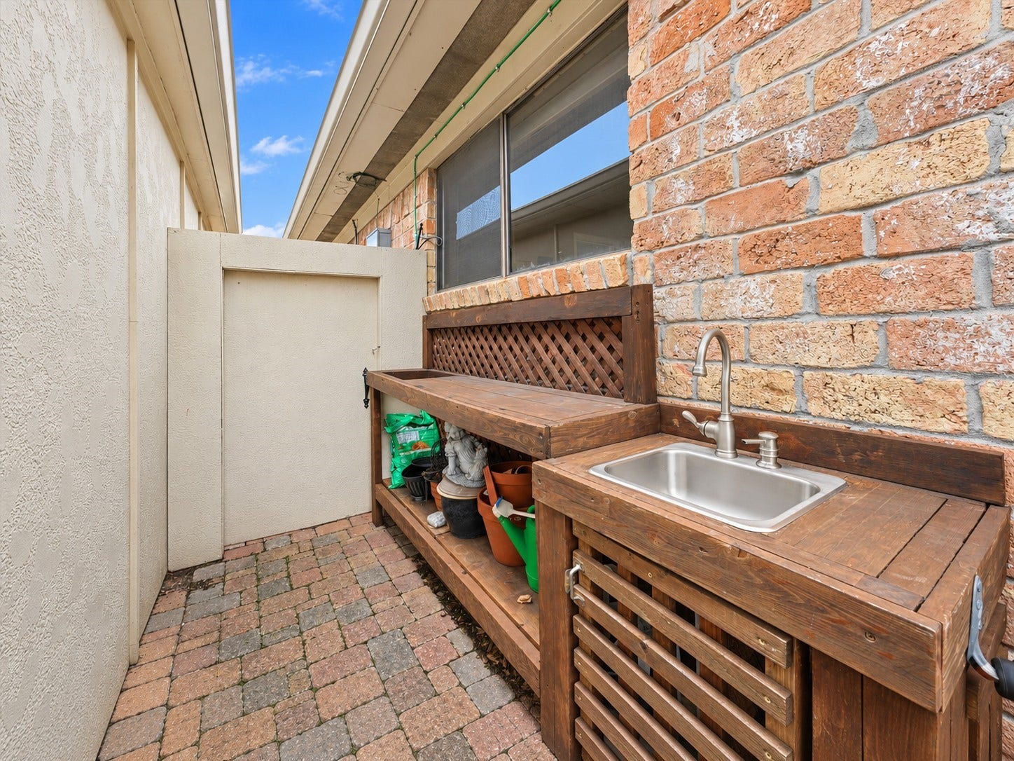 The back patio also features a planting station with sink!