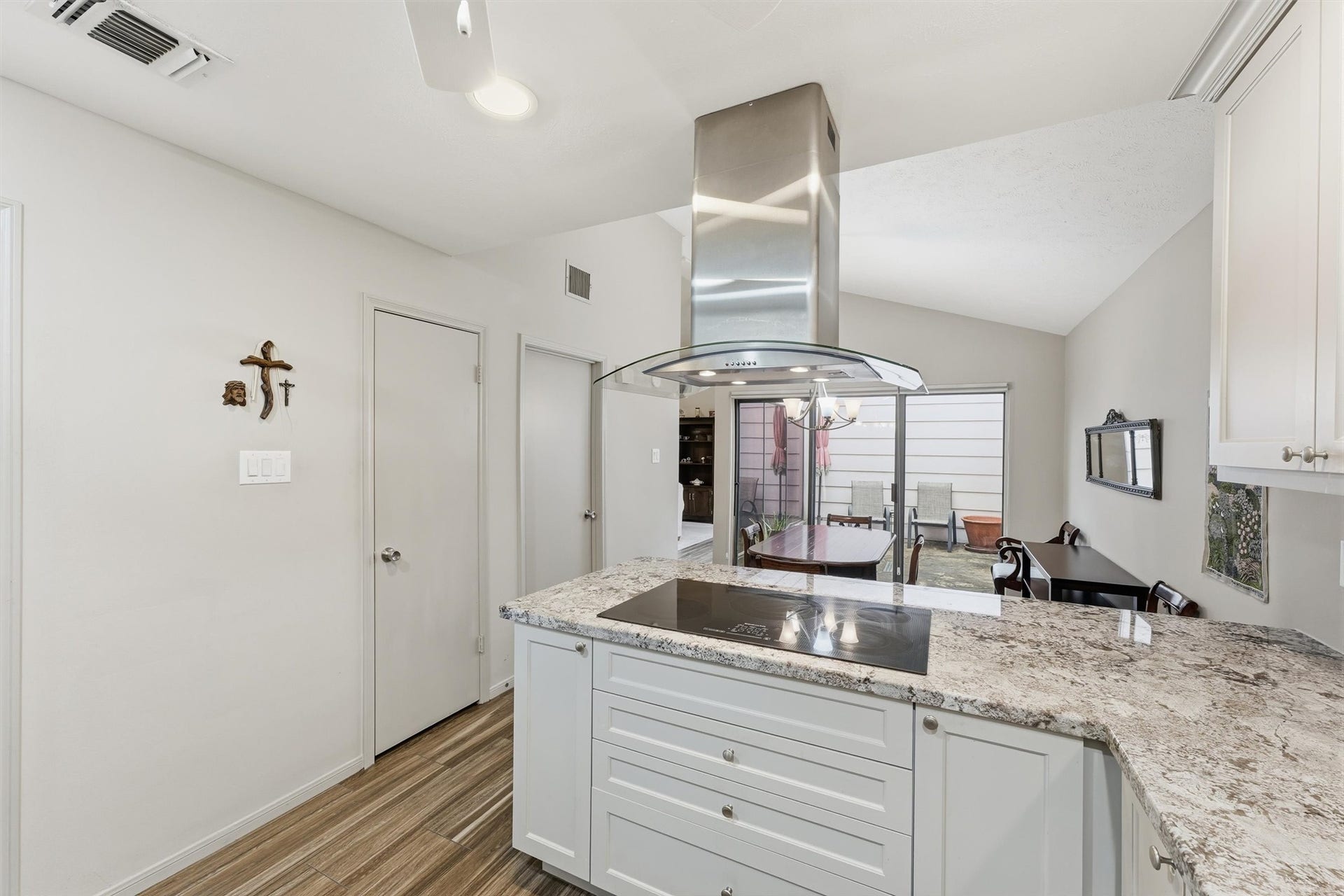 Off the open kitchen is a fabulous walk-in pantry and a laundry room with cabinet storage.  This home offers so much storage space & a great view of the atrium!