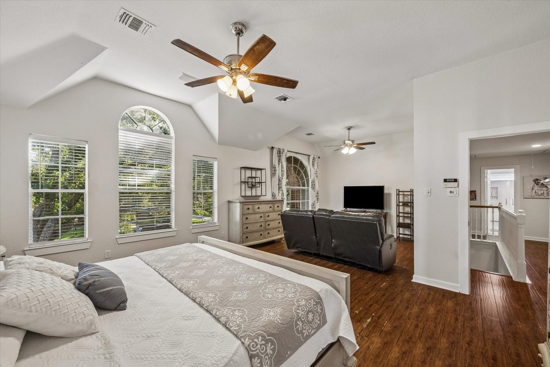 3615 Garrettsville Drive, Pearland, TX 77584 Oversized primary bedroom with abundant natural light from large windows and an adjoining cozy sitting area, perfect for relaxation.