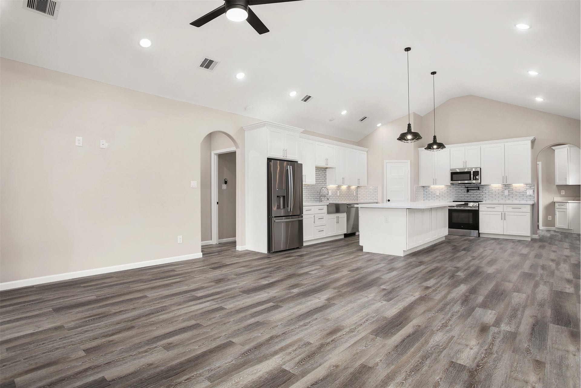3617 Pecan Drive, Bacliff, TX 77518 Living room and kitchen with faulted ceiling