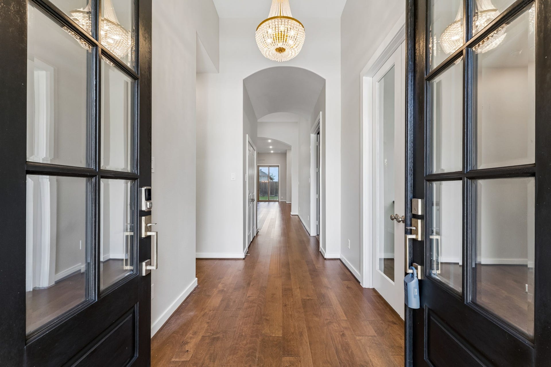 30410 Myrtle Oak Drive, Fulshear, TX 77423 Lovely engineered wood floors greet you through double front doors into an entryway adorned with a beautiful chandelier.