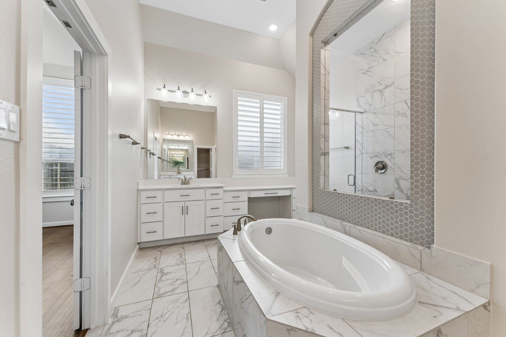 30410 Myrtle Oak Drive, Fulshear, TX 77423 Primary bath with modern finishes and relaxing soaking tub.