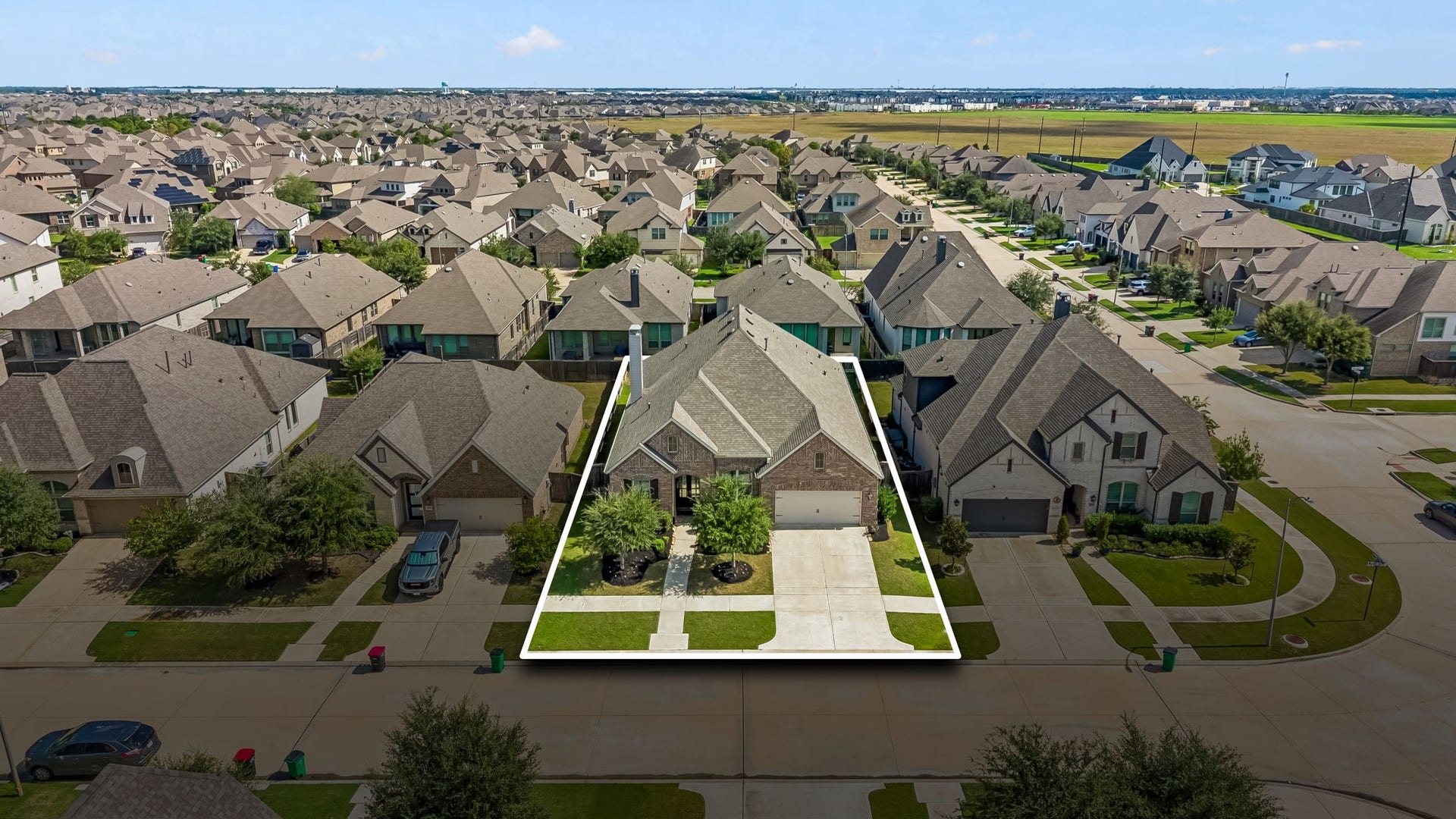 30410 Myrtle Oak Drive, Fulshear, TX 77423 Graciously situated on a quiet, tree-lined street, this home features mature oak trees and exceptional curb appeal.