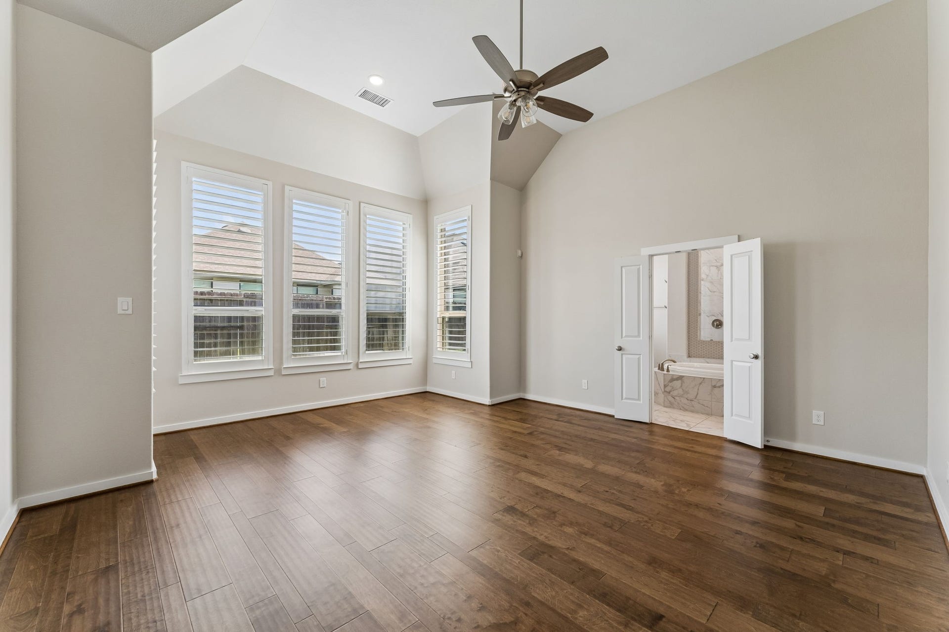 30410 Myrtle Oak Drive, Fulshear, TX 77423 Escape to your own private sanctuary in this expansive primary suite, which showcases soaring high ceilings that create an airy, voluminous feel.