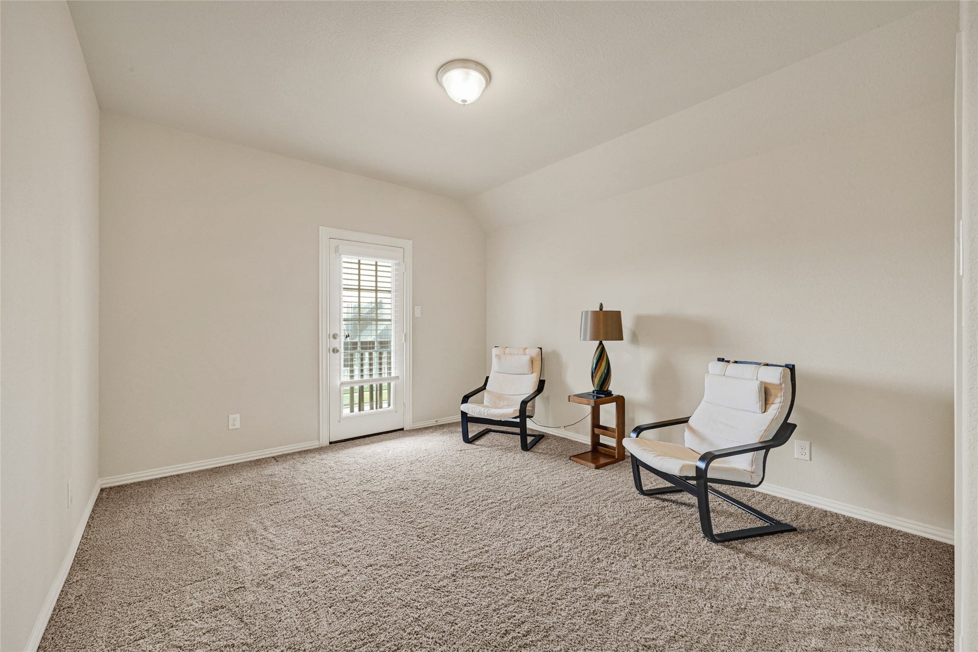 6258 Murphy Wood Drive, League City, TX 77573 Second bedroom upstairs with a balcony, perfect to wait to be serenaded.