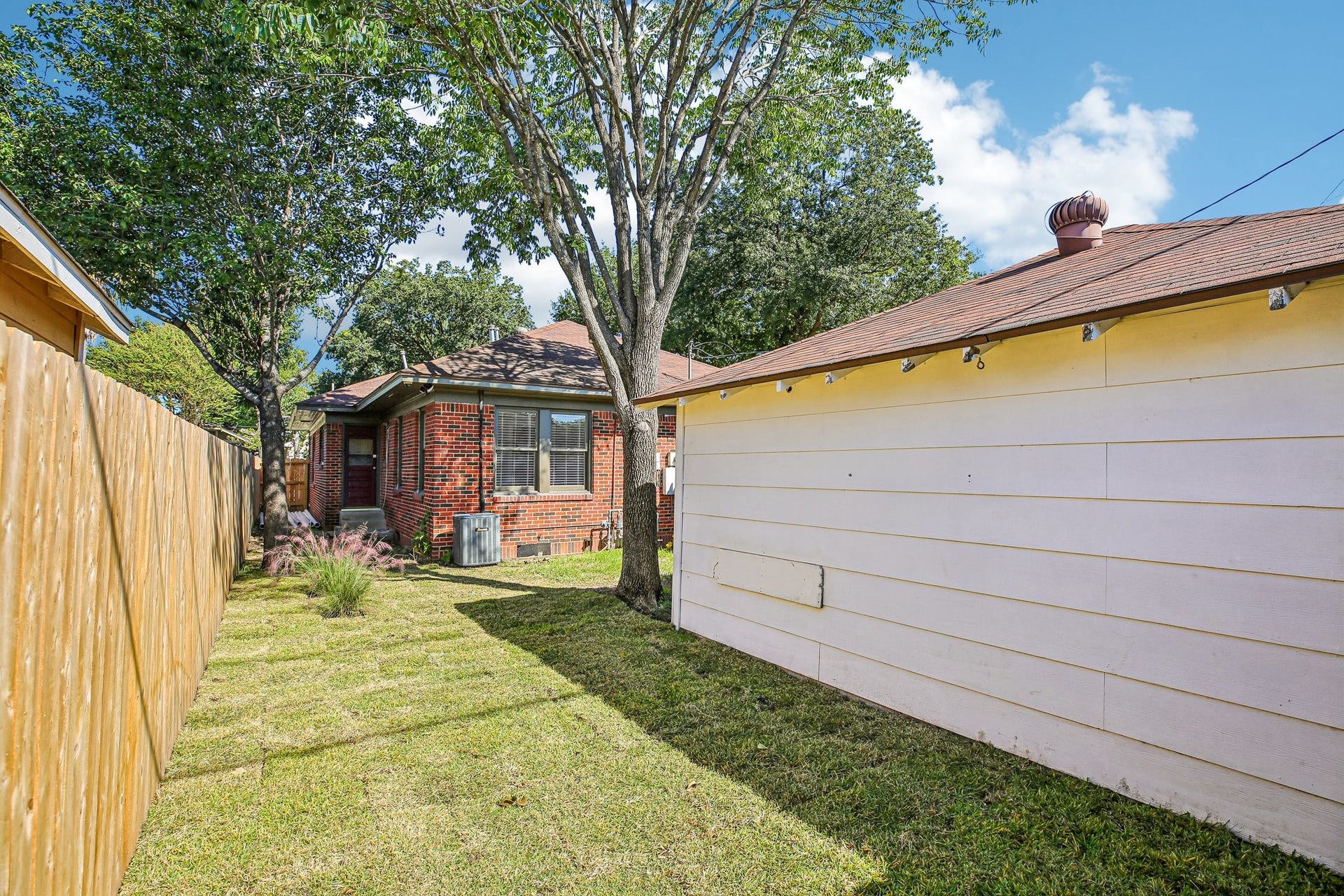 1104 Key Street, Houston, TX 77009 The private yard is accessible through a gate at the driveway and from the kitchen door in the house.