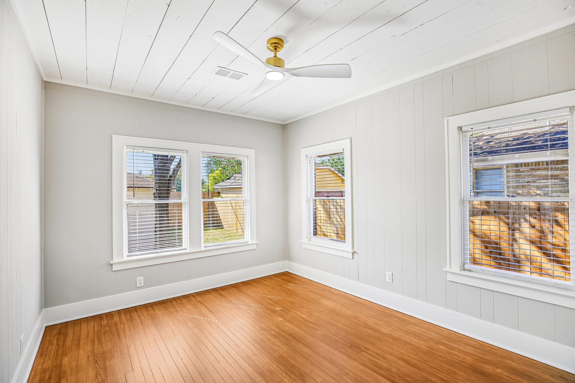 1104 Key Street, Houston, TX 77009 The bedroom features reverse paint from the living room and the same stylish ceiling fan.