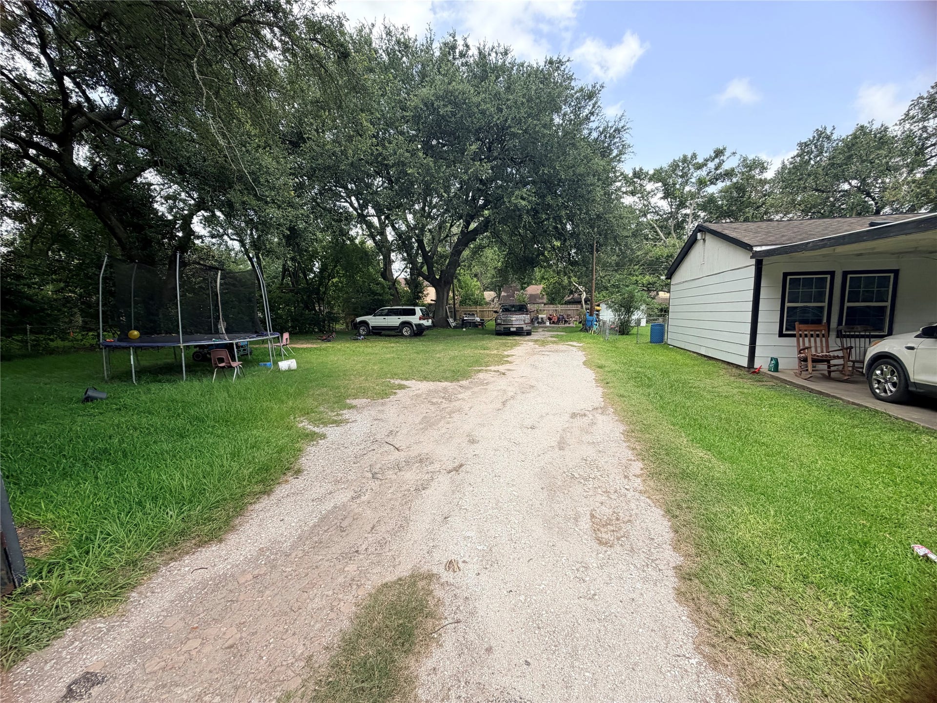 1207 Pirtle Street, La Marque, TX 77568 Looking into the property from the driveway, this homesite is ready for your vision with public water and sewer available.