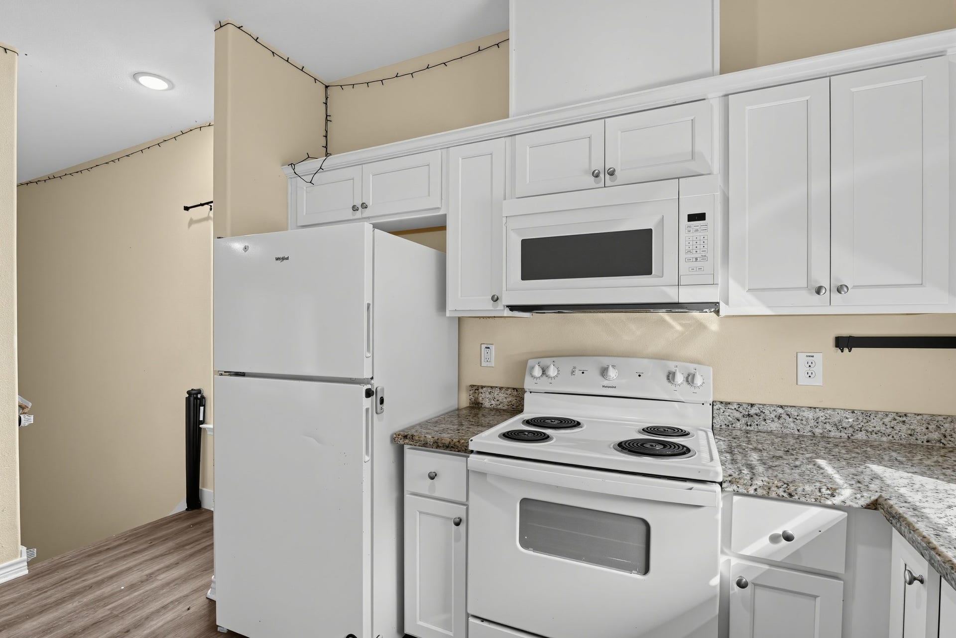 3717 Church Street Street, Galveston, TX 77550 Kitchen has granite counters, built-in microwave.