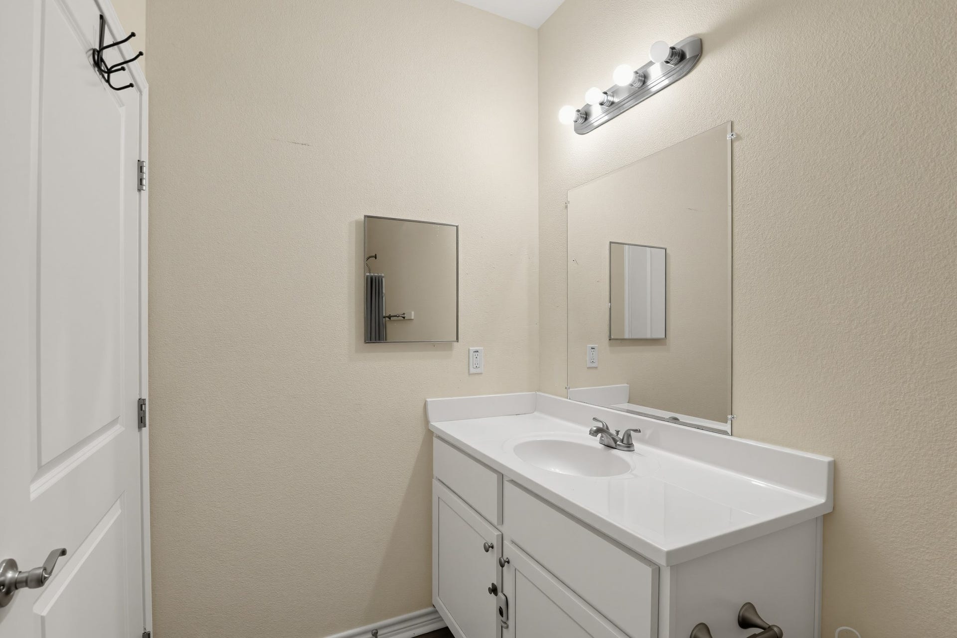 3717 Church Street Street, Galveston, TX 77550 Bathroom vanity with an integrated cultured marble sink.