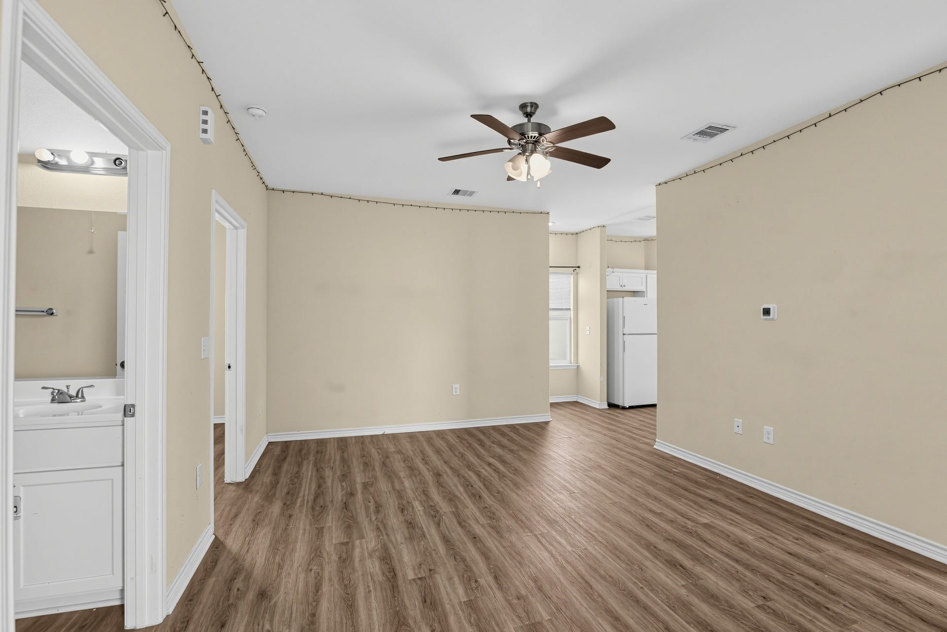3717 Church Street Street, Galveston, TX 77550 A spacious family room offering a seamless view into the kitchen entryway.