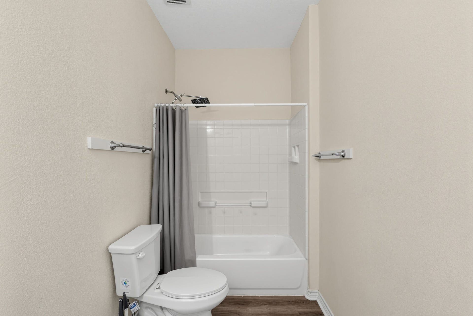 3717 Church Street Street, Galveston, TX 77550 A bathroom featuring a bathtub and a tiled shower enclosure.