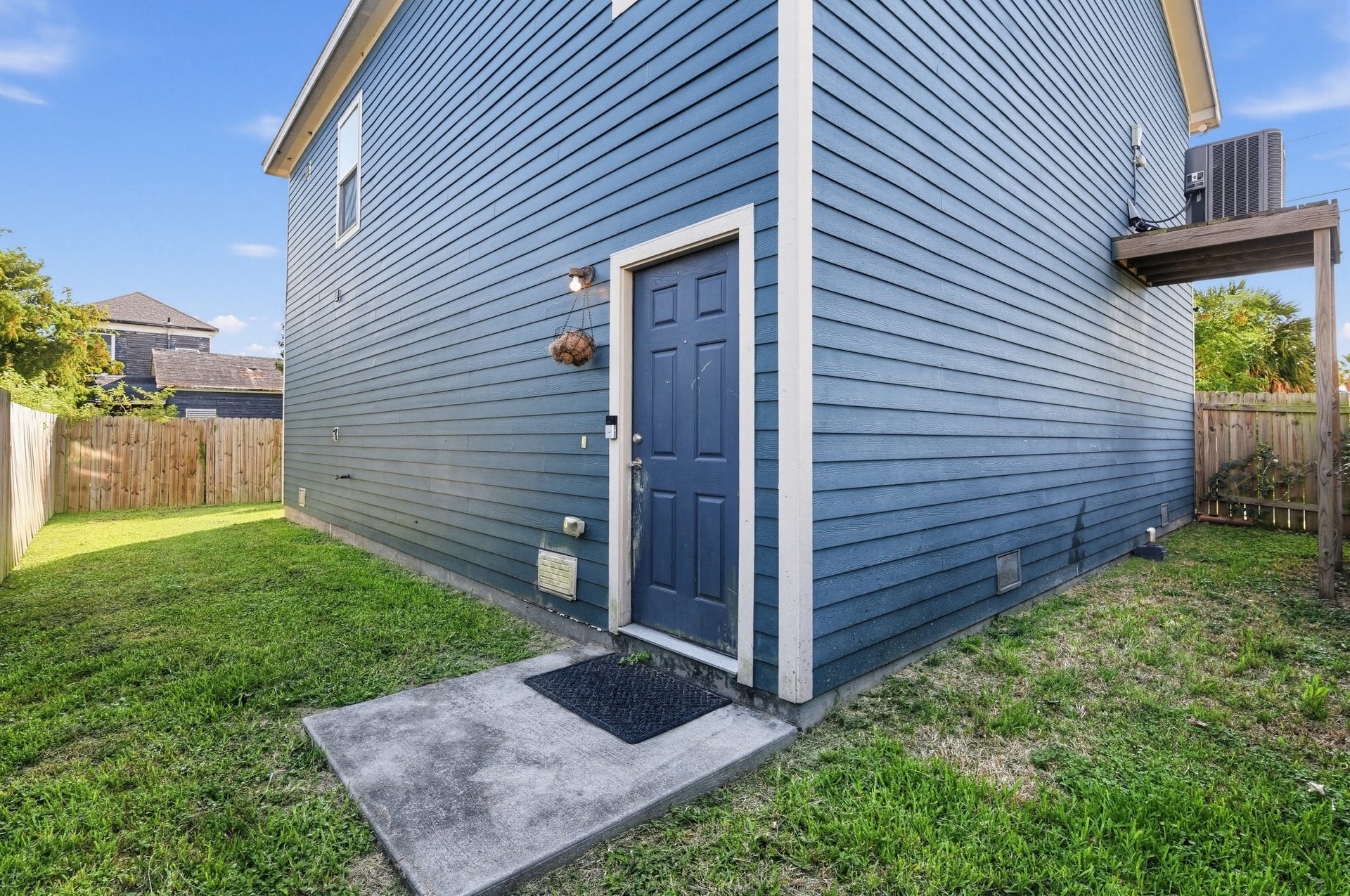 3717 Church Street Street, Galveston, TX 77550 Back of the home with entry door. Elevated AC compressor.