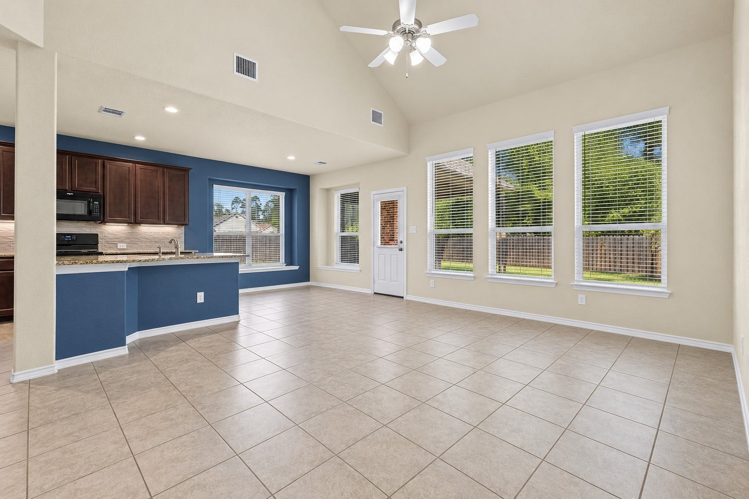 655 W Linnwood Drive, Woodbranch, TX 77357 Beautifully designed open-concept layout seamlessly connecting the kitchen and living areas, with an inviting breakfast nookperfect for morning coffee, everyday dining, and memorable gatherings!