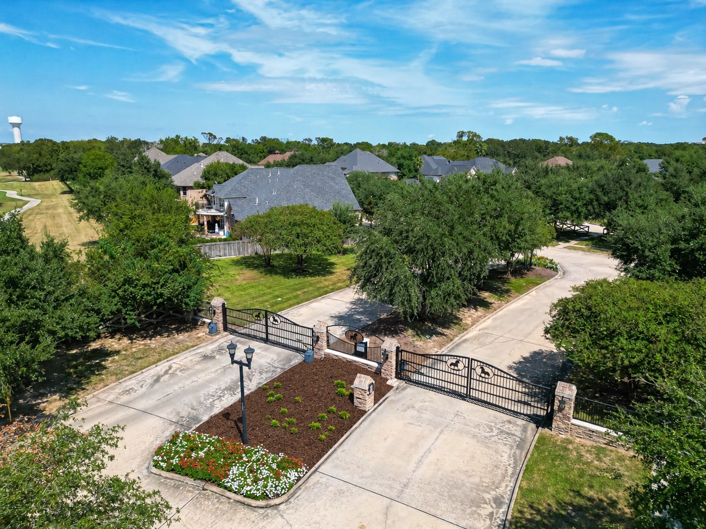 11803 Silverwood Bend Lane, Cypress, TX 77433 Gated entrance to a serene residential community, featuring lush greenery and well-maintained landscaping, offering privacy and a welcoming atmosphere.
