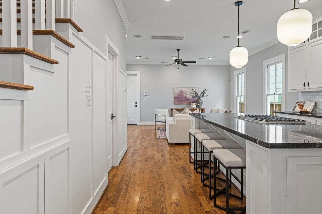 Expansive kitchen island offers ample seating and an effortless connection to the living room.