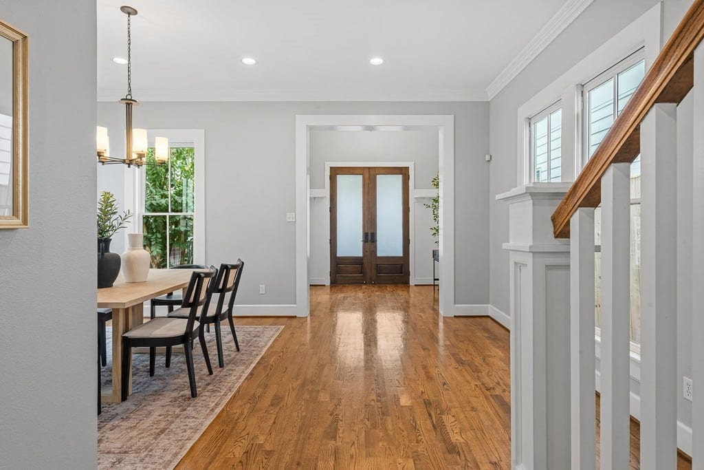 Beautiful sightlines connect the formal dining room, entry, and adjoining living spaces.