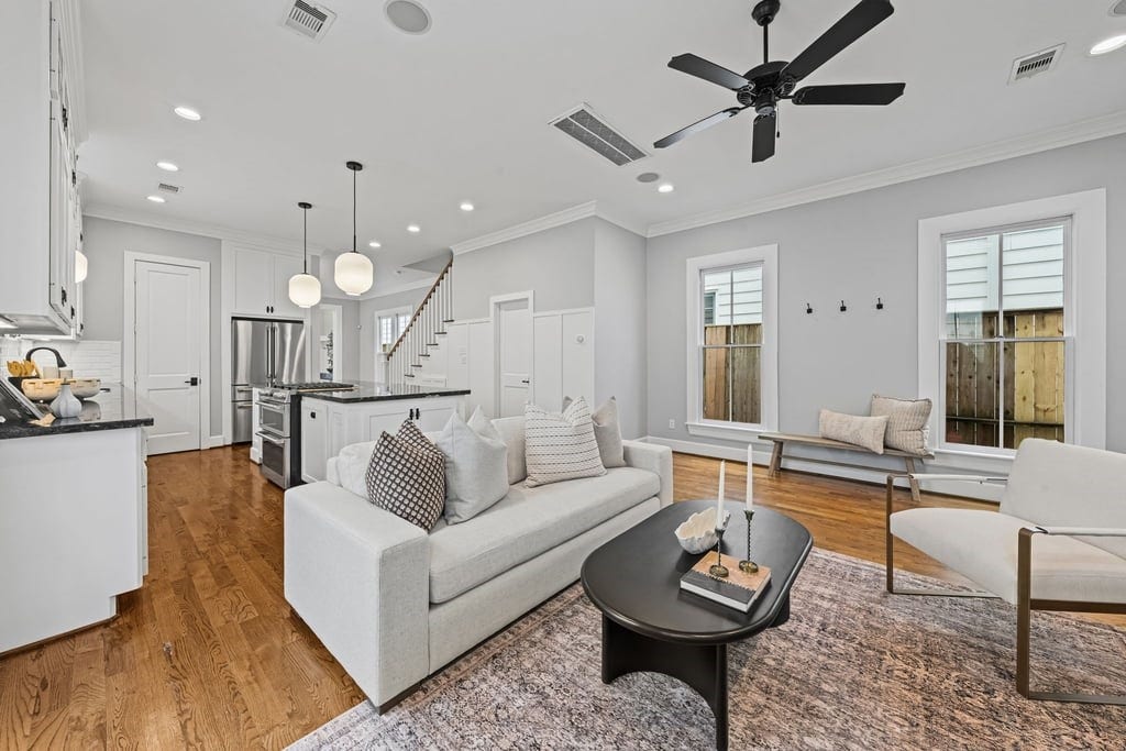 Open-concept living area with beautiful natural light and seamless access to the kitchen.