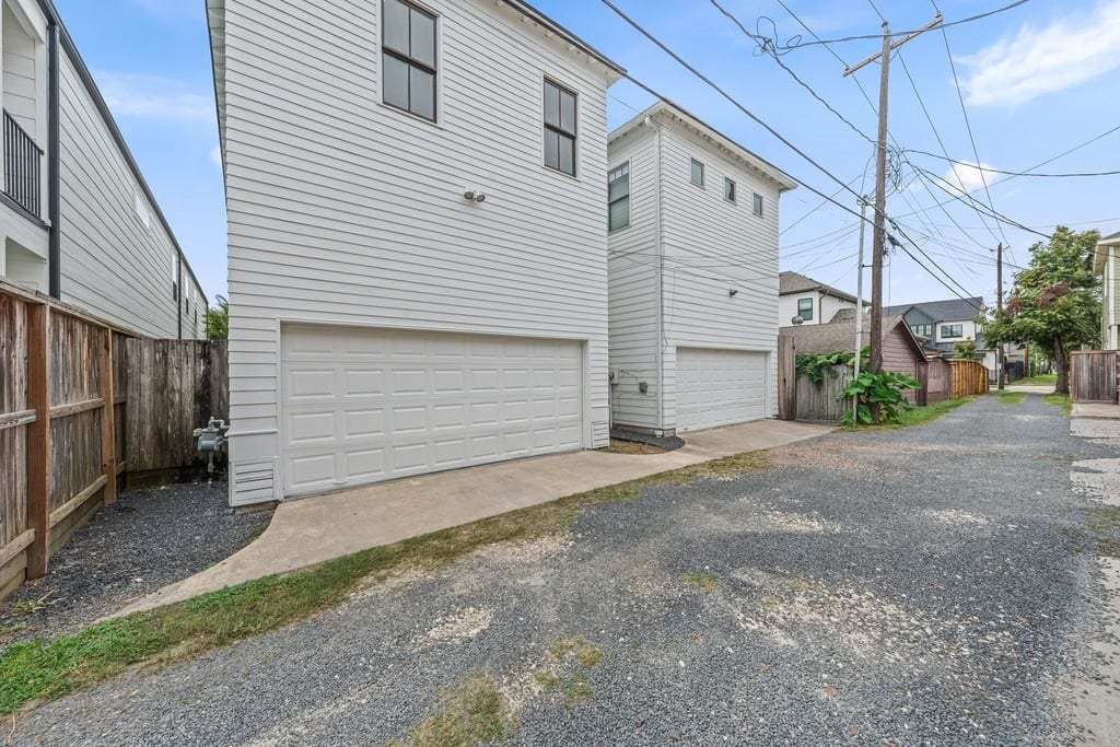 Oversized two-car garage with convenient rear access, a coveted amenity in the Heights.