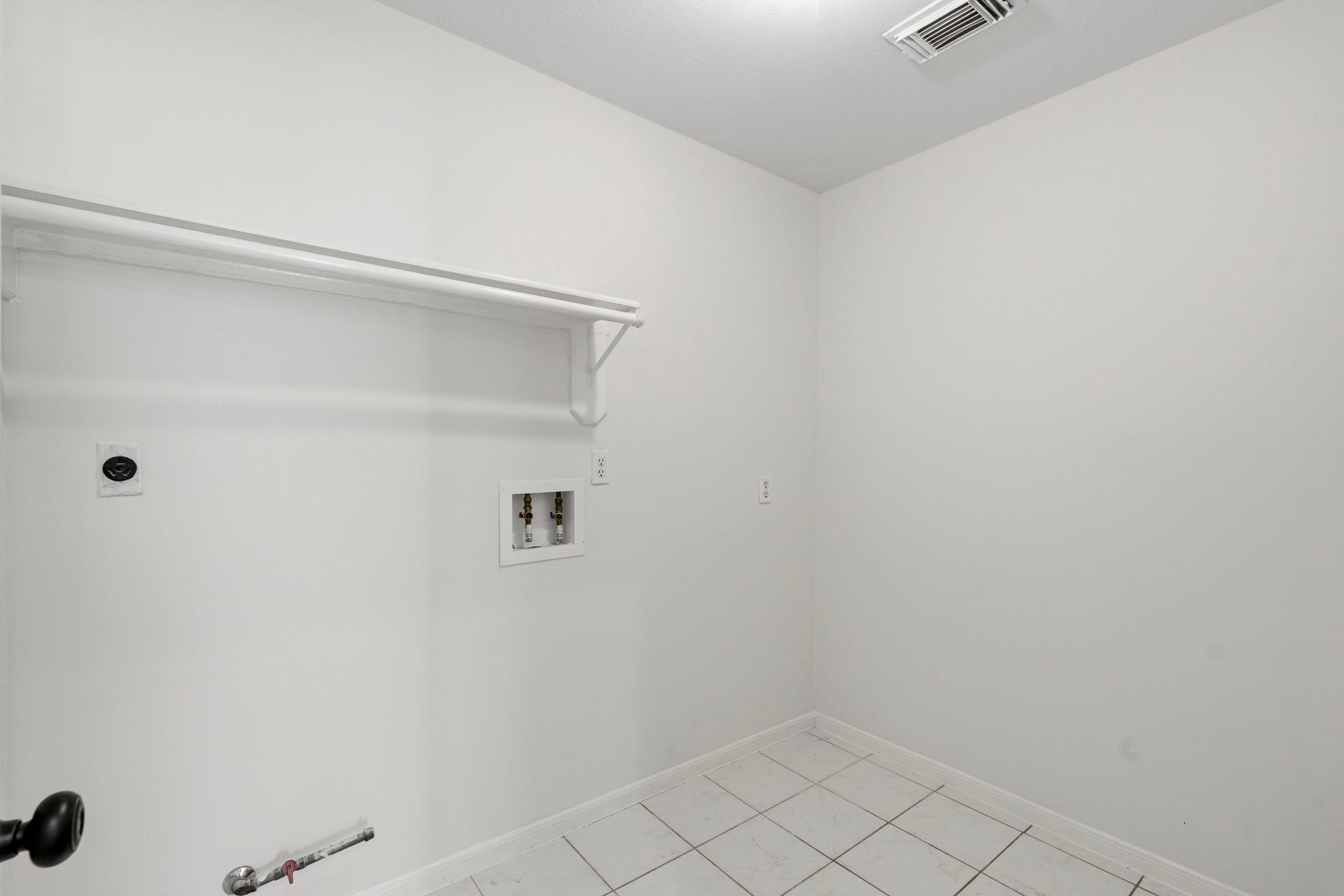 Large laundry room with room for the extra freezer/fridge