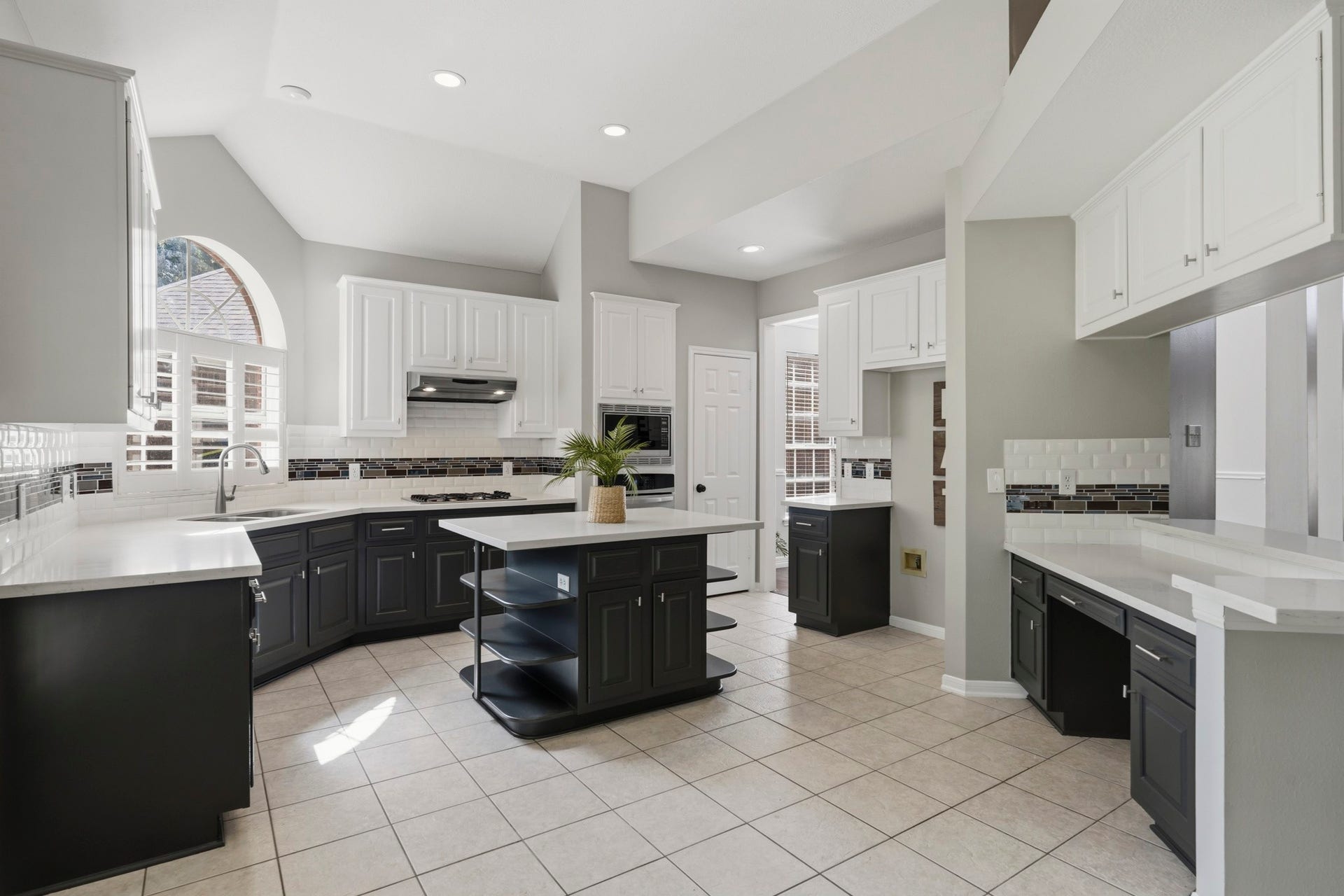 Kitchen opens to the family room and offers dining room passage.