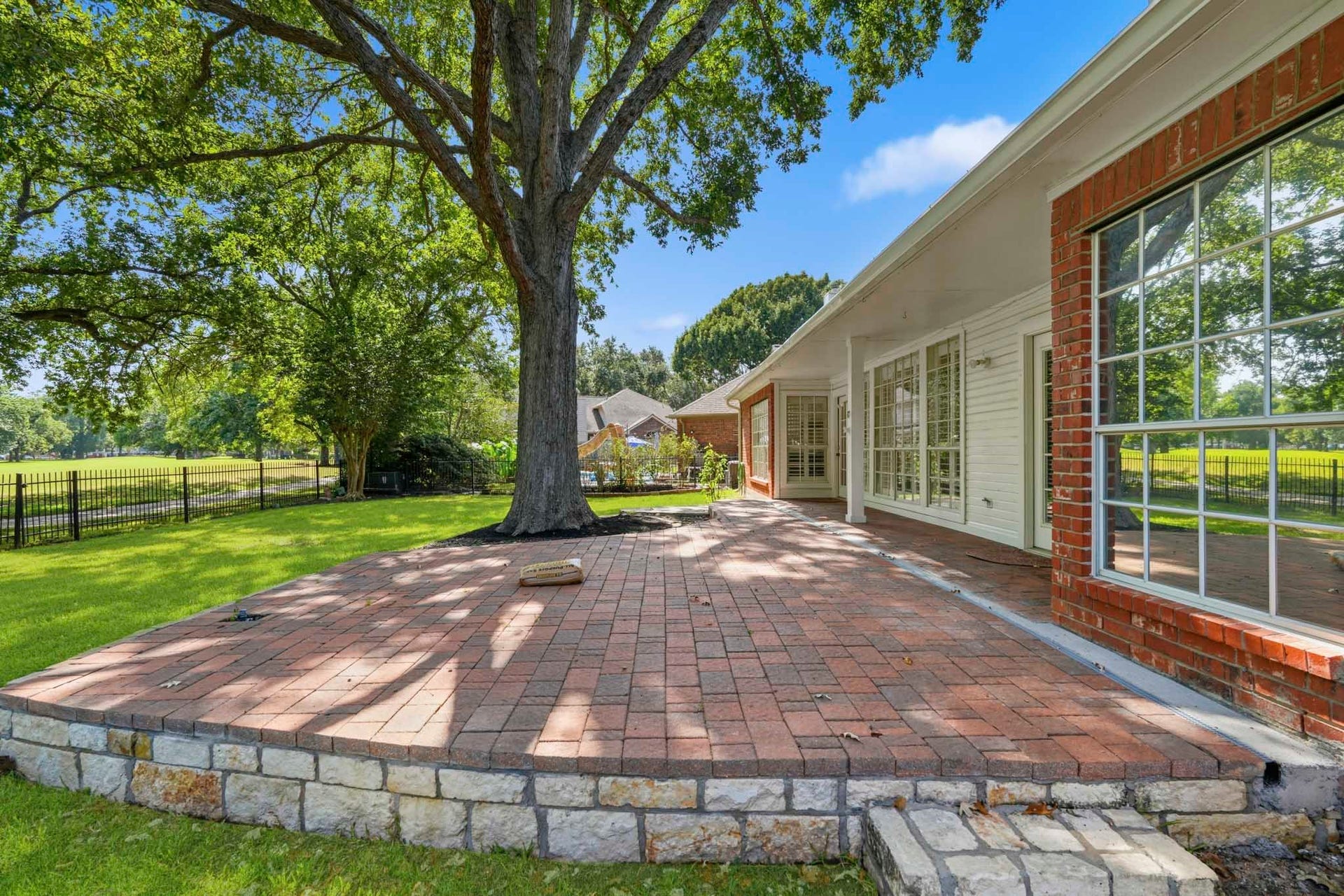 Enjoy coffee or bar b cues on this paved patio.