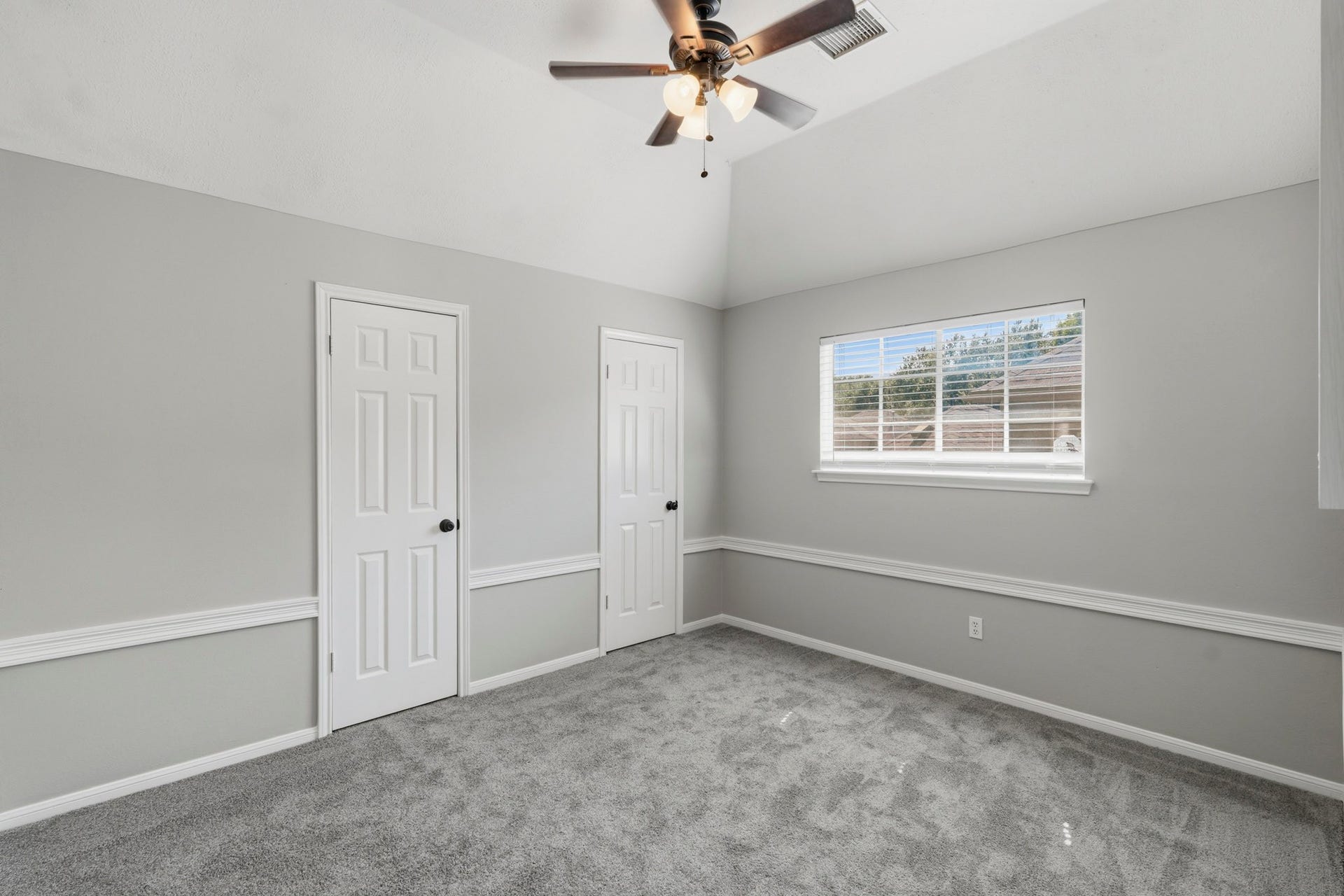 Secondary bedroom with walk in closet.