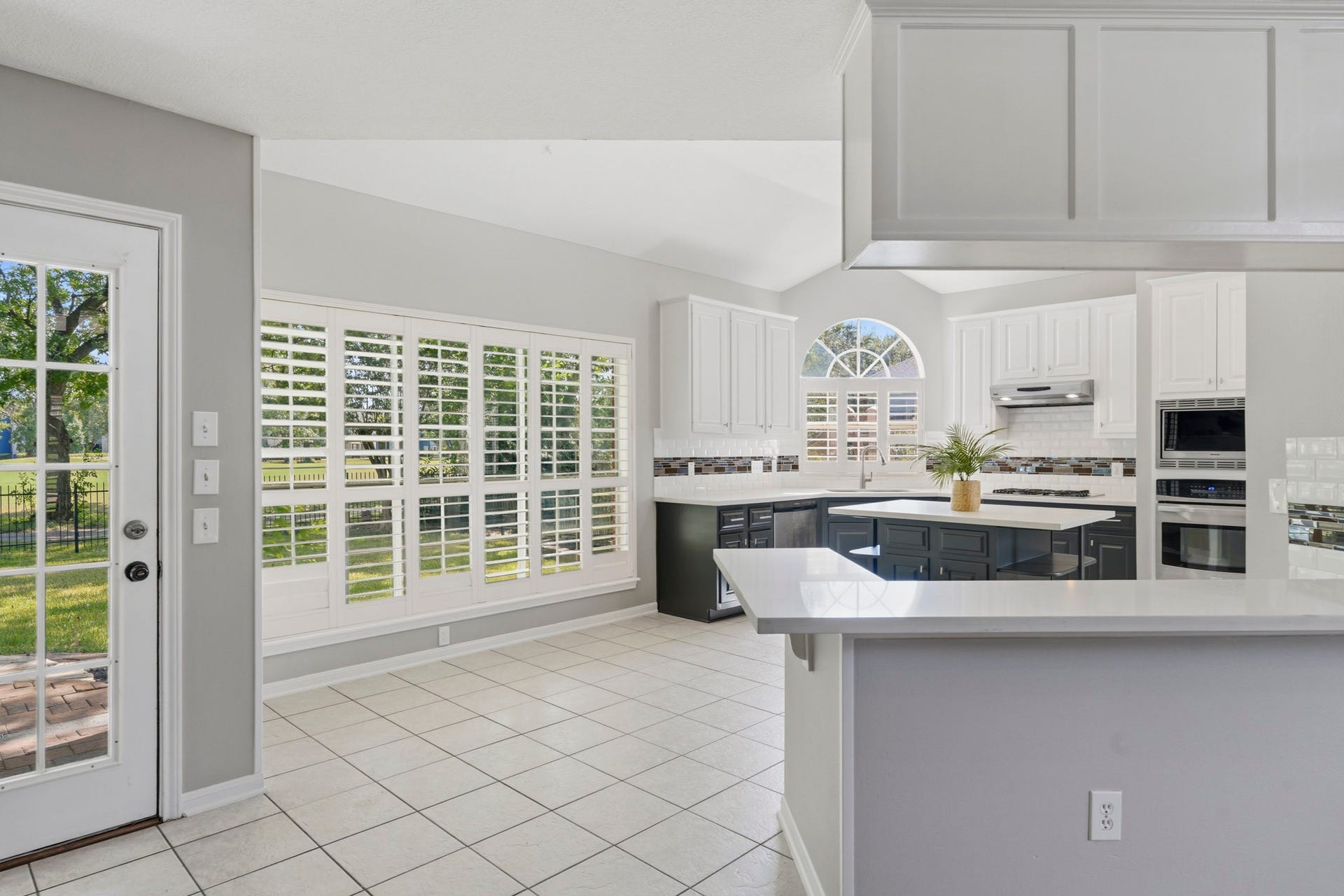 Plantation shutters! Quartz counter tops in the kitchen!
