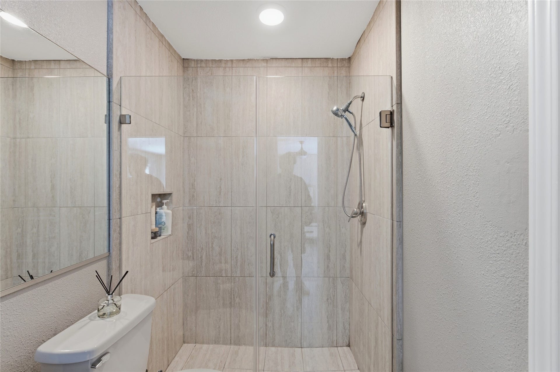 2211 Kinbrook Drive, Houston, TX 77077 Ensuite primary bath featuring a frameless glass walk-in shower.