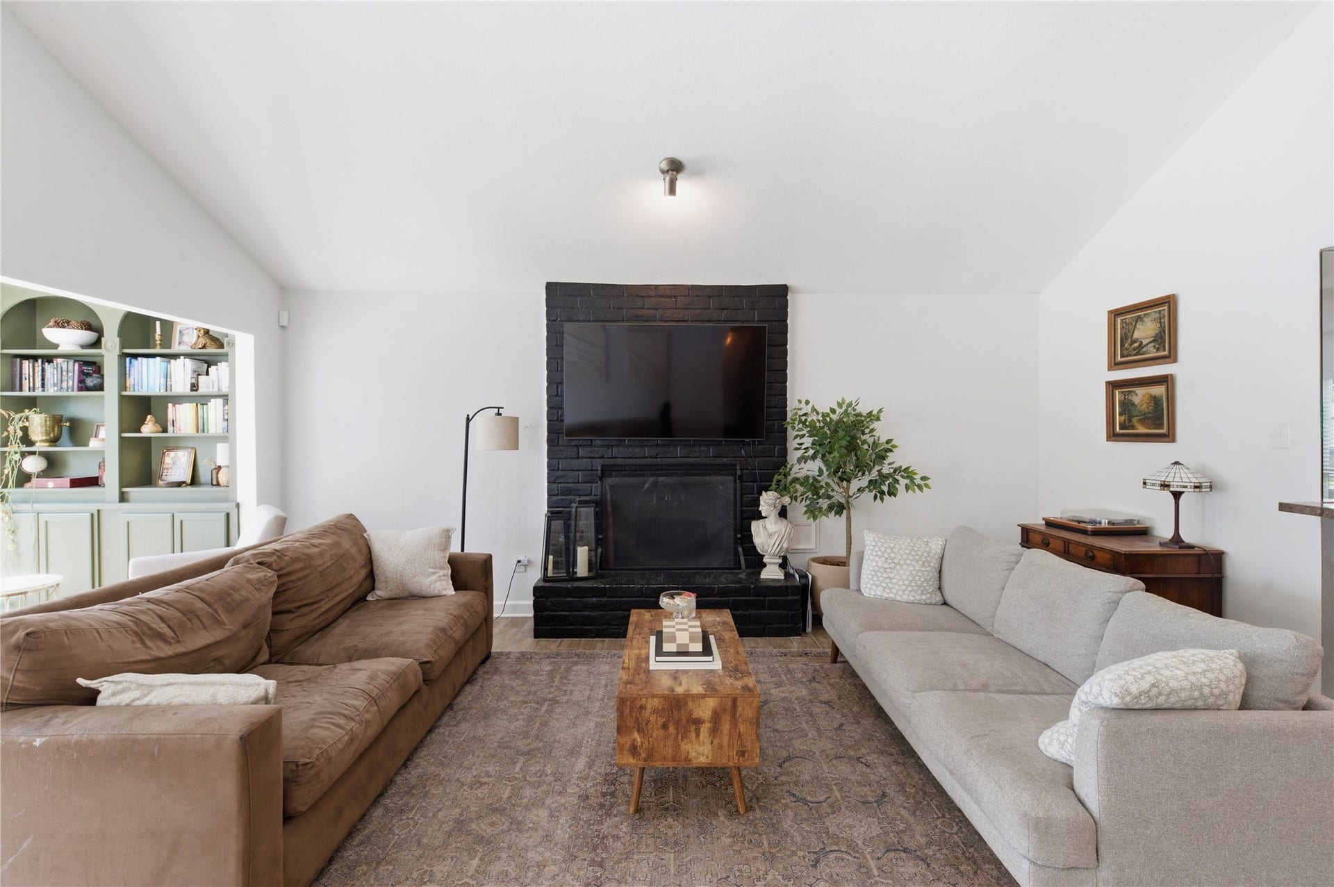 2211 Kinbrook Drive, Houston, TX 77077 Focal point fireplace adds warmth and character to the living room.